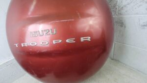 ISUZU TROOPER OEM DARK RED REAR SPARE TIRE COVER SHELL EMBLEM – 1995–2002 2nd Gen