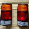 ISUZU OPEL CAMPO UTE TAIL LIGHTS PAIR LH & RH – BLACK FRAME | 1988–1991 1st Gen